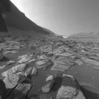 A graphic of the NASA "meatball" insignia, a blue circle crossed by a red V-shaped swoosh, against a black background.